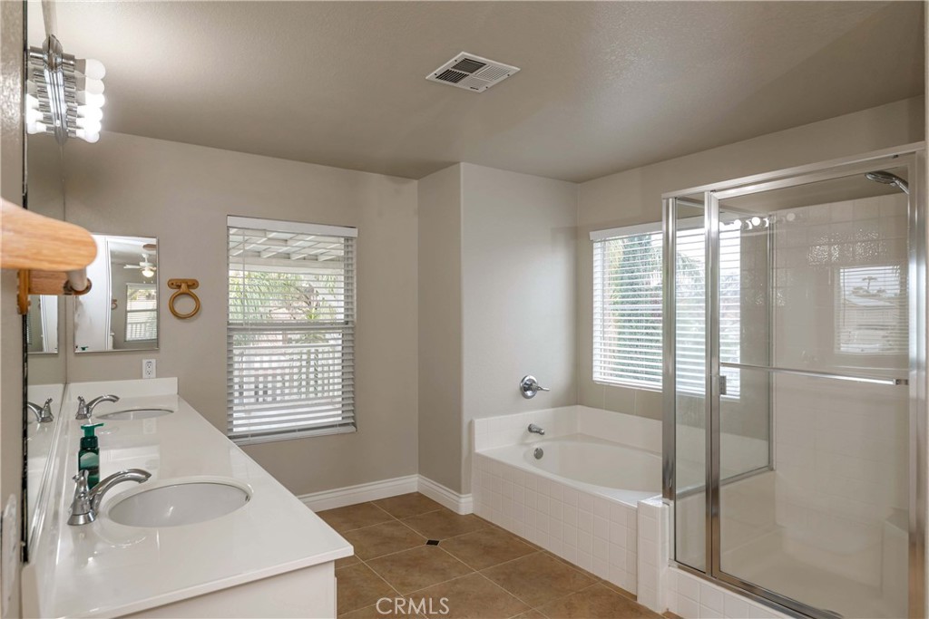 9220 Village Way Riverside, CA 92508 - Photo 35 of 73 a bathroom with a tub sink and a window