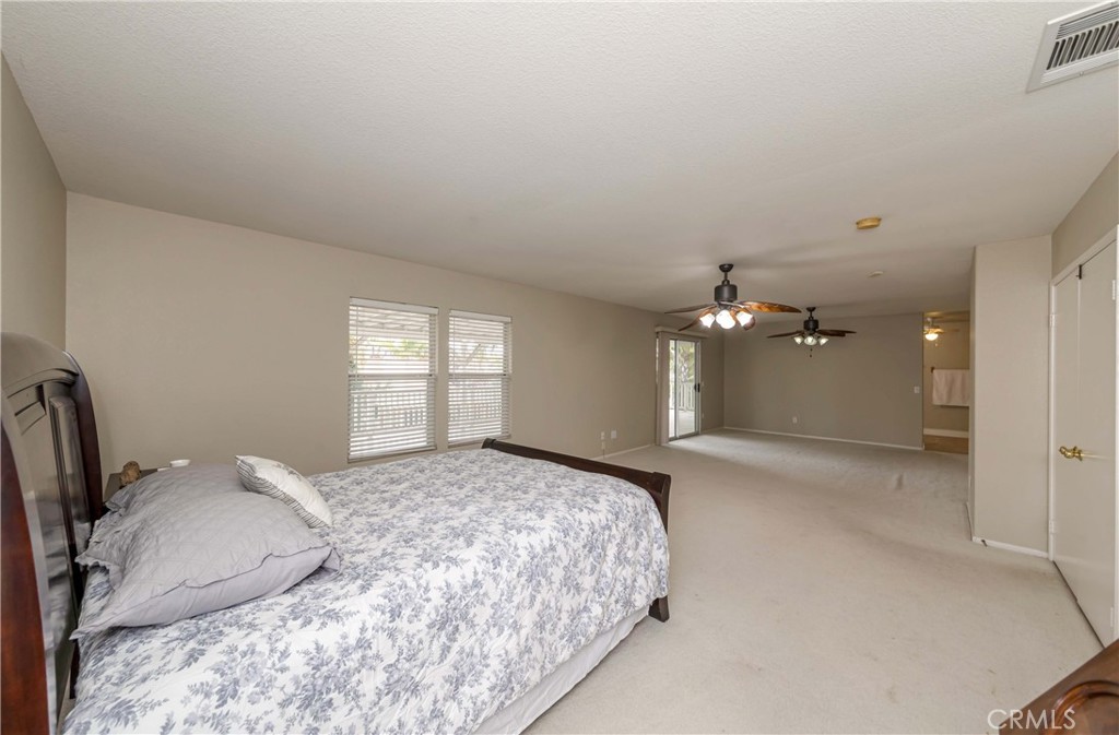 9220 Village Way Riverside, CA 92508 - Photo 39 of 73 a spacious bedroom with a bed and window