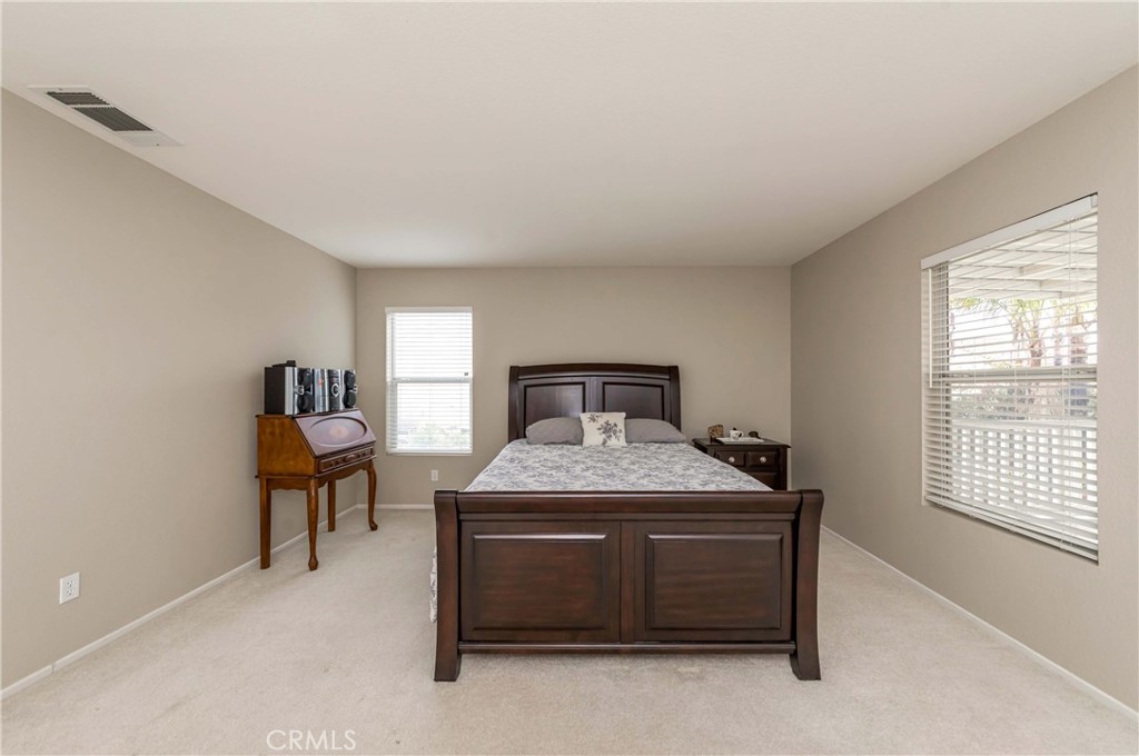 9220 Village Way Riverside, CA 92508 - Photo 41 of 73 a bedroom with a bed and a chair
