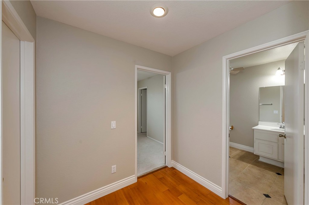 9220 Village Way Riverside, CA 92508 - Photo 54 of 73 a view of a bathroom with wooden floor and a sink