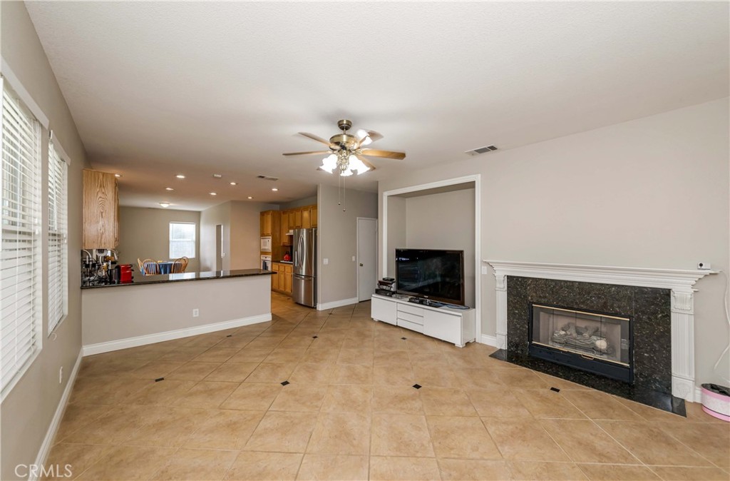 9220 Village Way Riverside, CA 92508 - Photo 56 of 73 a view of a livingroom with a fireplace a window and a fireplace