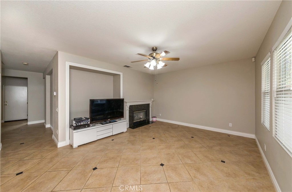 9220 Village Way Riverside, CA 92508 - Photo 58 of 73 a view of an empty room with a fireplace and a window
