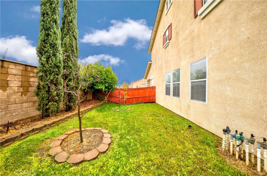 9220 Village Way Riverside, CA 92508 - Photo 73 of 73 a backyard of a house with table and chairs