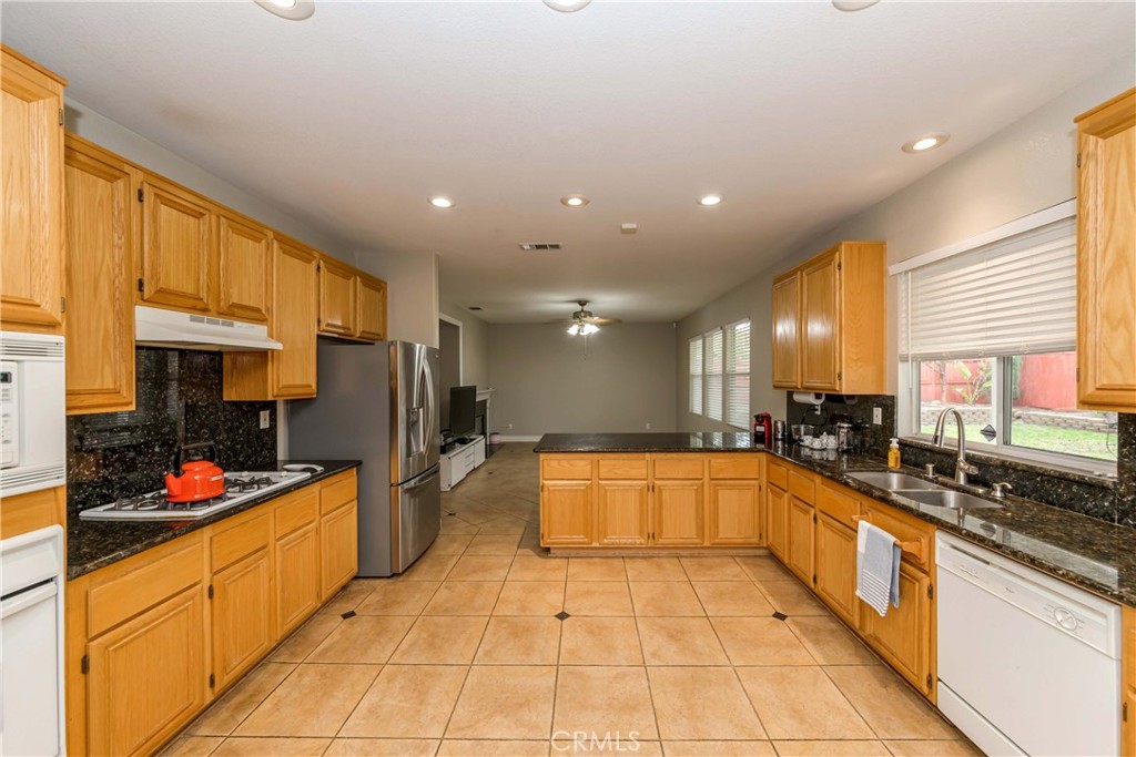 9220 Village Way Riverside, CA 92508 - Photo 8 of 73 a large kitchen with stainless steel appliances lots of counter top space