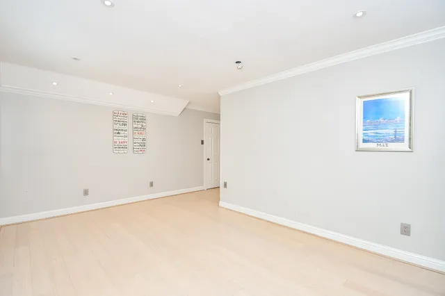 a bathroom with a sink vanity mirror and toilet