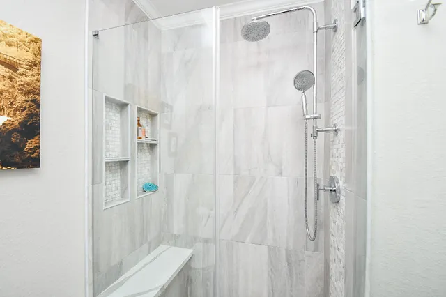 a bedroom with a bed and a book shelf
