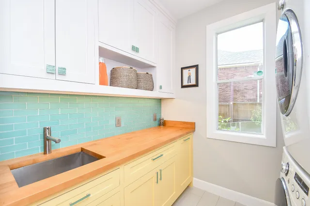 a view of a hallway with washer and dryer
