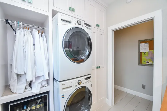 a kitchen with stainless steel appliances granite countertop a sink a stove and a refrigerator