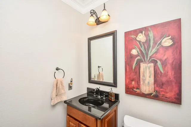 a hallway with furniture and wooden floor