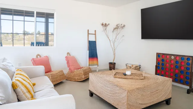 a living room with furniture and flat screen tv