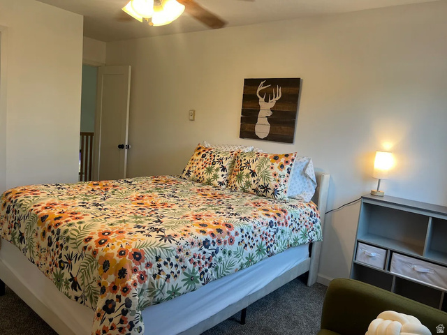 2807 North Ogden Canyon Road Eden, UT 84310 - Photo 30 of 72 Bedroom featuring a ceiling fan with light fixture, neutral wall tones, and gray carpeting