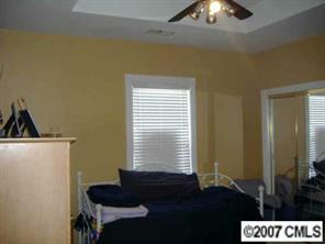 9070 Meadow Vista Road Charlotte, NC 28213 - Photo 6 of 8 a living room with furniture and a window