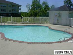 9070 Meadow Vista Road Charlotte, NC 28213 - Photo 8 of 8 a view of outdoor space swimming pool and green space