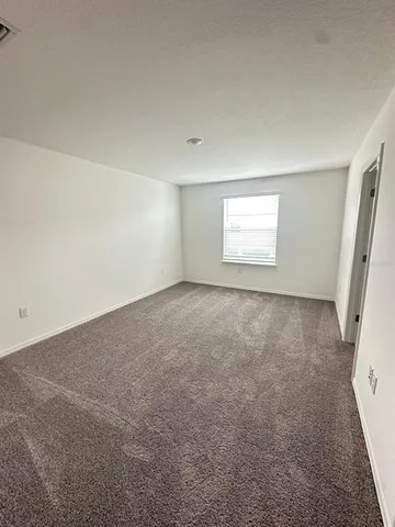 a bathroom with a shower and a toilet