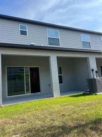 a picture of a table & chairs in a kitchen