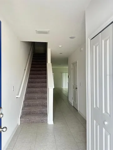 a view of entryway and hall with a rug
