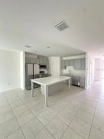 a room with furniture a table and chairs