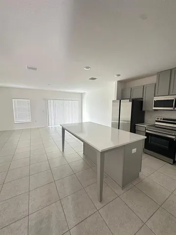 a room with a table and chairs