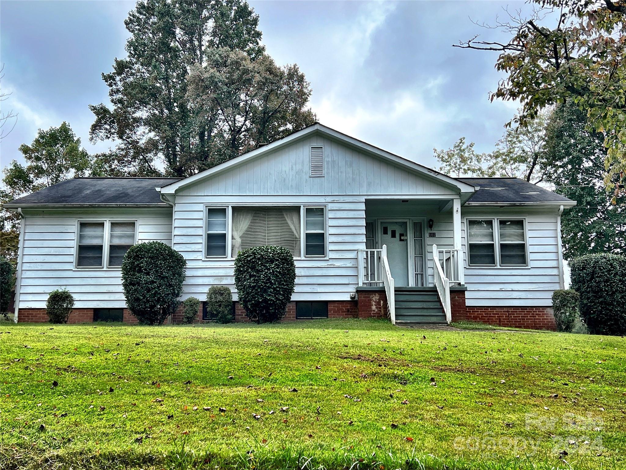 102 Steakhouse Road Morganton, NC 28655 - Photo 1 of 39 a front view of house with yard and green space
