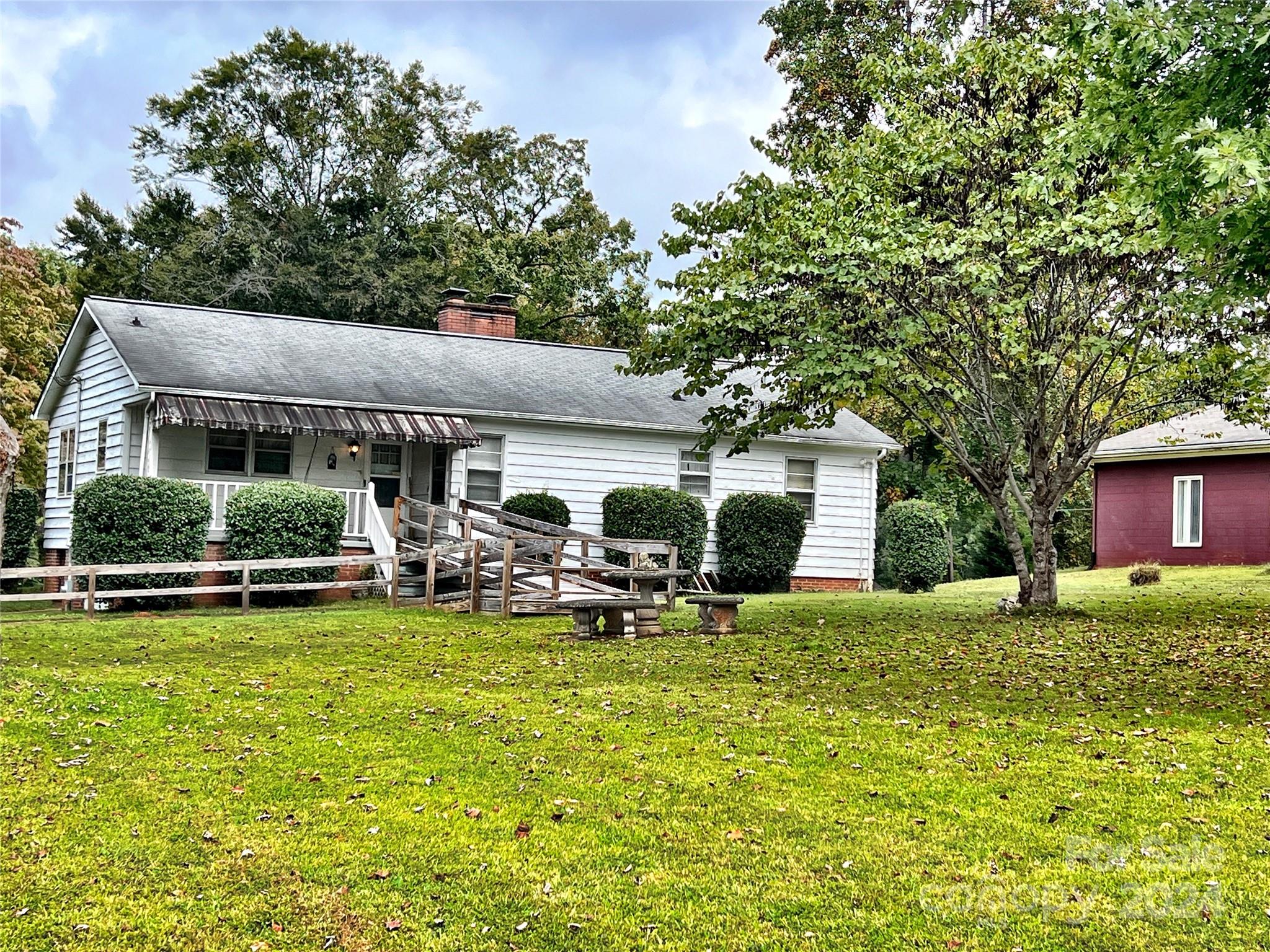 102 Steakhouse Road Morganton, NC 28655 - Photo 11 of 39 a view of a house with swimming pool and sitting area