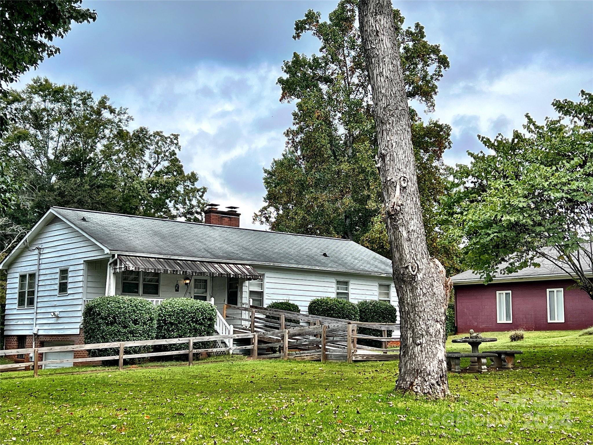102 Steakhouse Road Morganton, NC 28655 - Photo 12 of 39 front view of a house with a tree in a yard