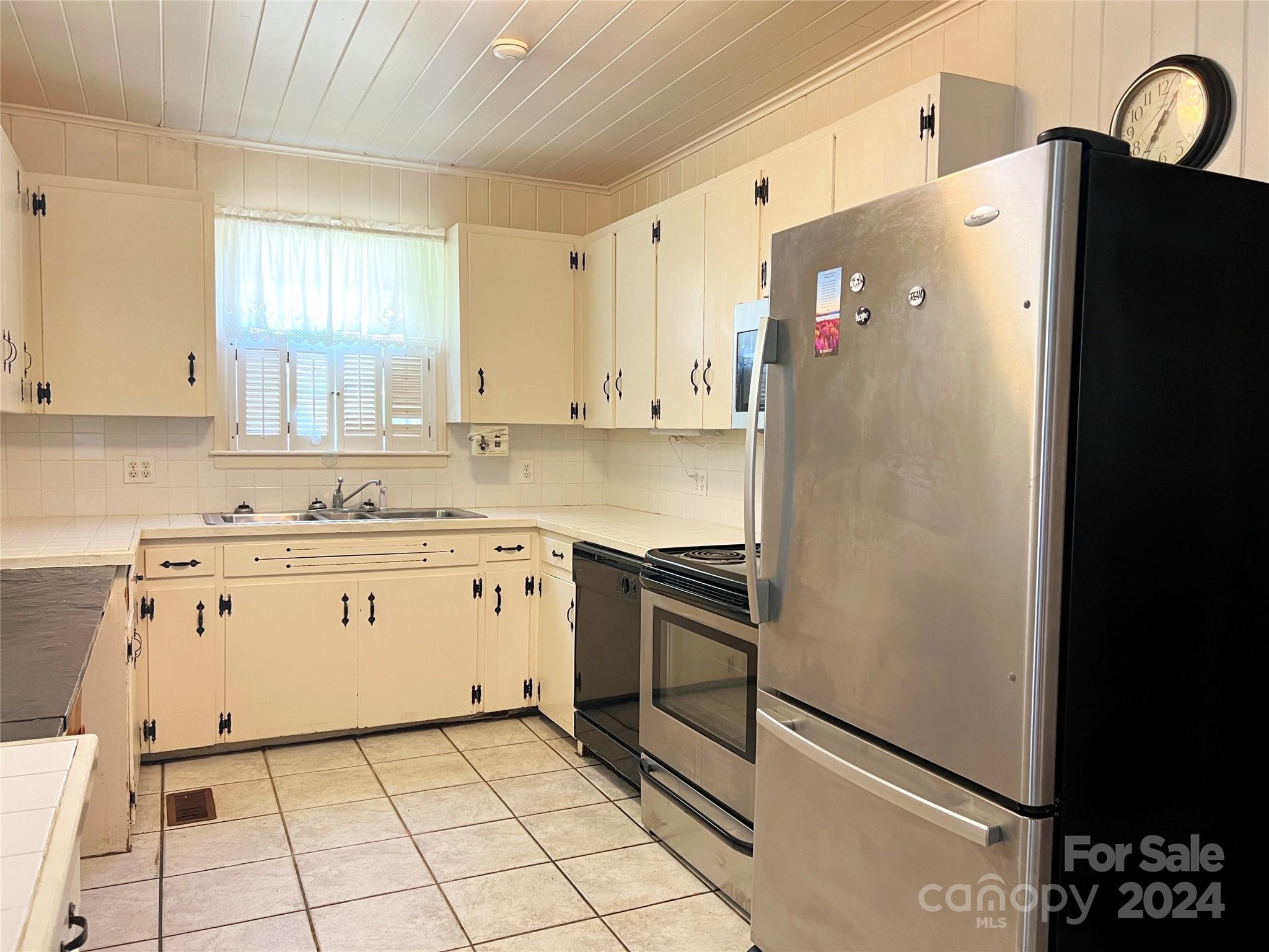102 Steakhouse Road Morganton, NC 28655 - Photo 16 of 39 a white refrigerator freezer sitting inside of a kitchen