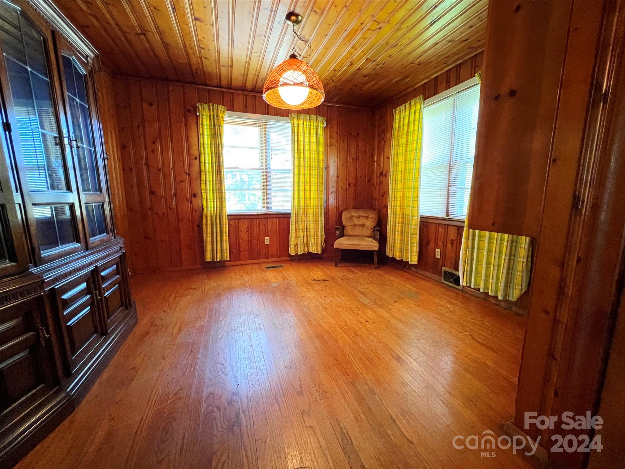 102 Steakhouse Road Morganton, NC 28655 - Photo 19 of 39 a view of an empty room with a window and wooden floor