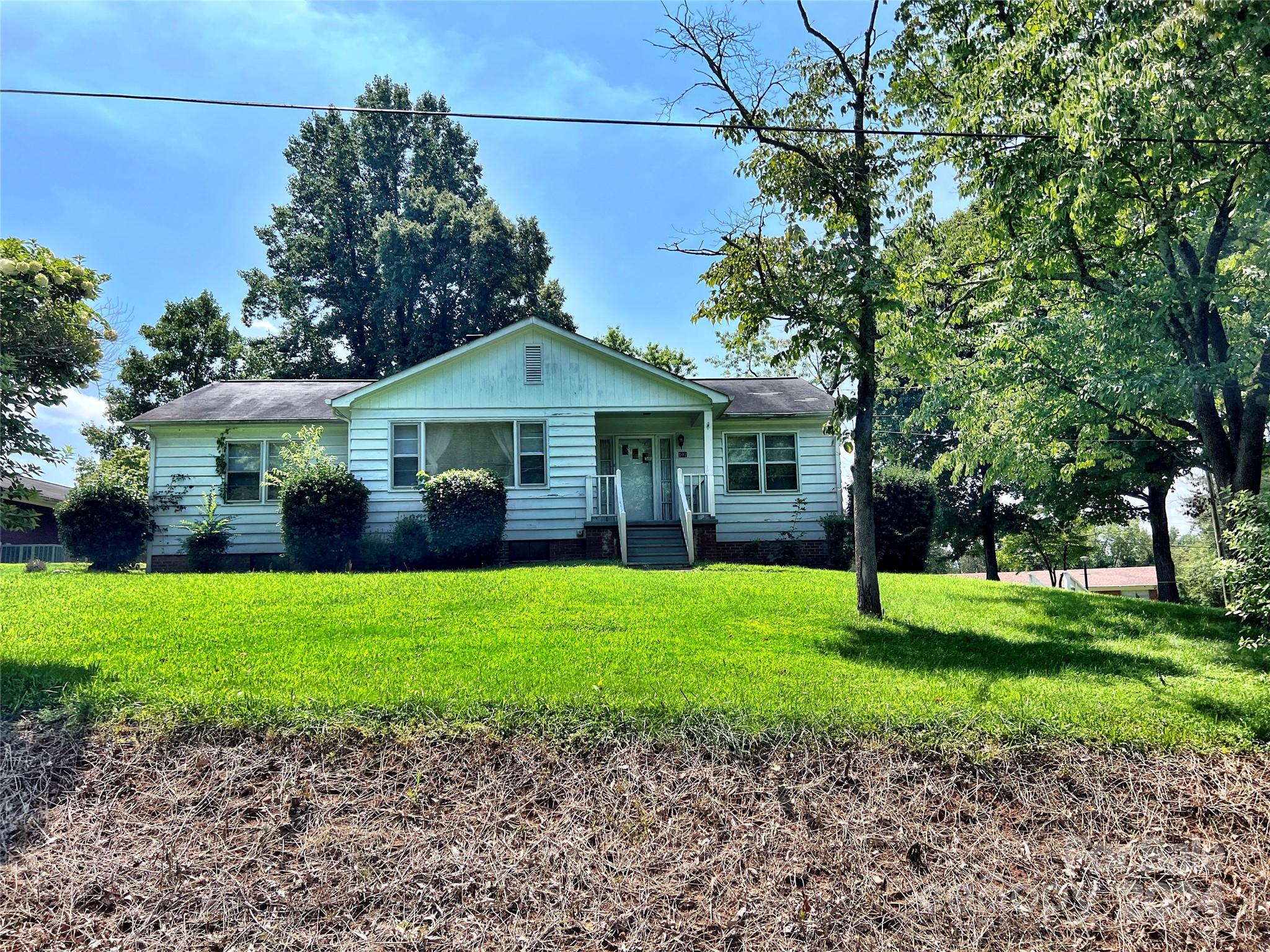 102 Steakhouse Road Morganton, NC 28655 - Photo 2 of 39 a front view of a house with a garden