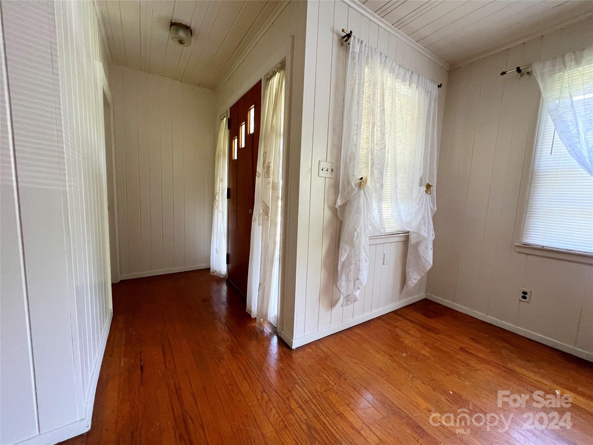 102 Steakhouse Road Morganton, NC 28655 - Photo 21 of 39 an empty room with wooden floor and a window