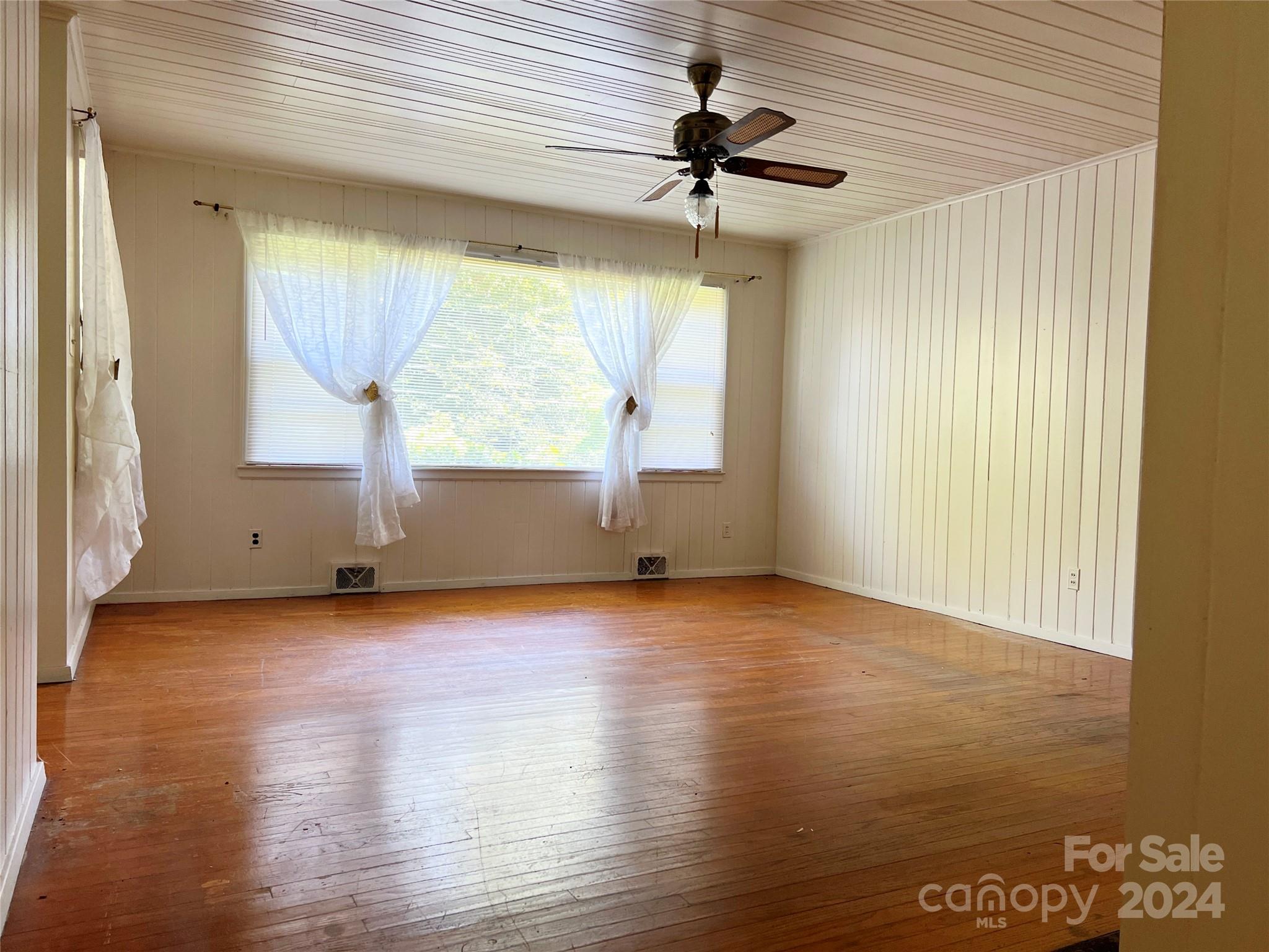 102 Steakhouse Road Morganton, NC 28655 - Photo 22 of 39 a view of room window and wooden floor