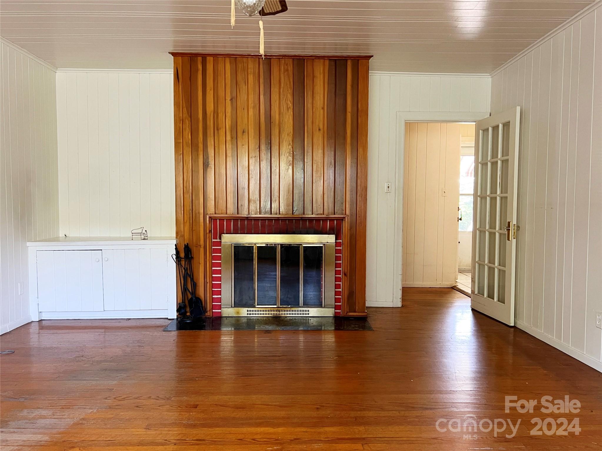102 Steakhouse Road Morganton, NC 28655 - Photo 23 of 39 an empty room with wooden floor windows and entryway