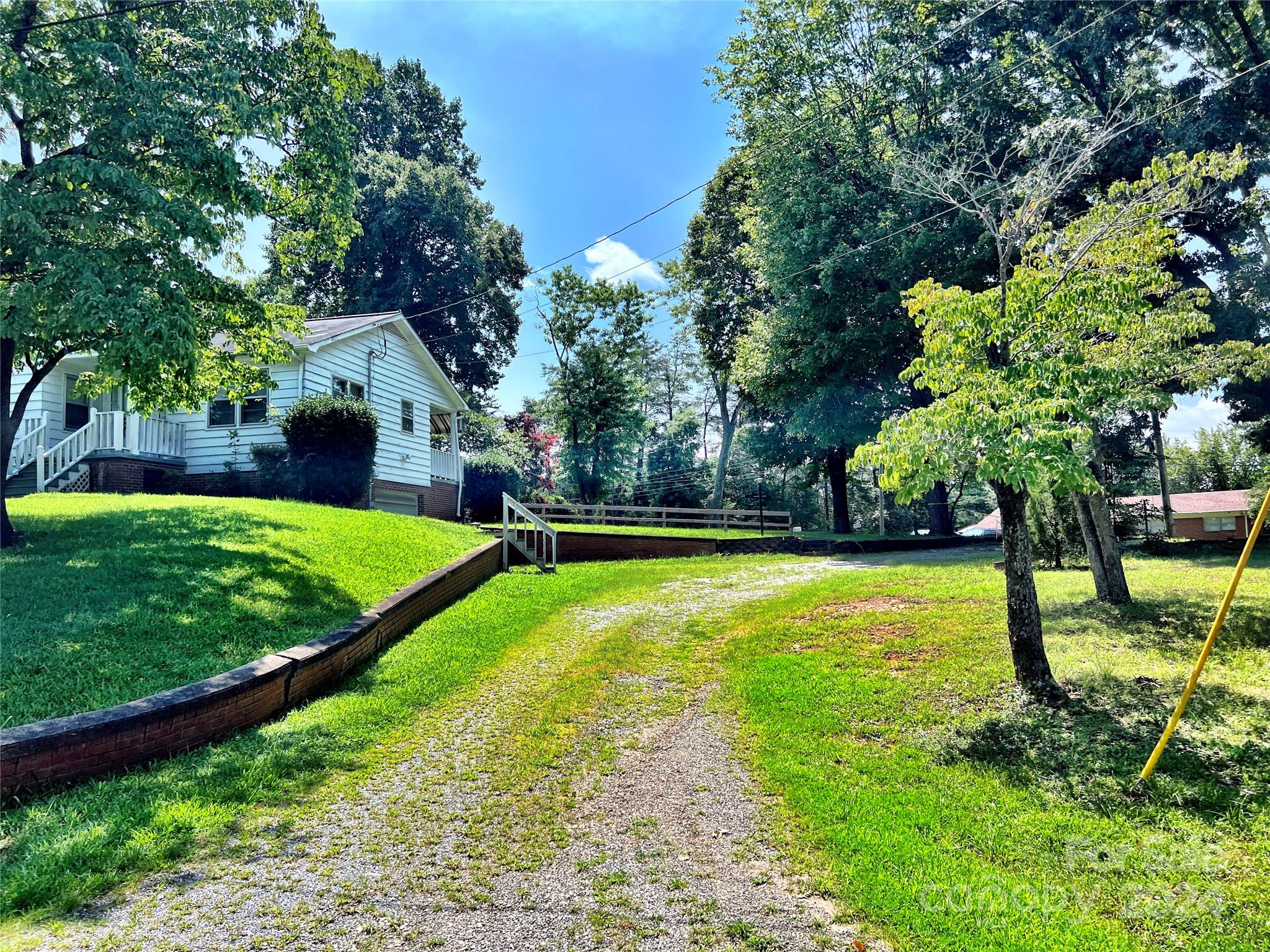 102 Steakhouse Road Morganton, NC 28655 - Photo 3 of 39 a view of a backyard with a garden