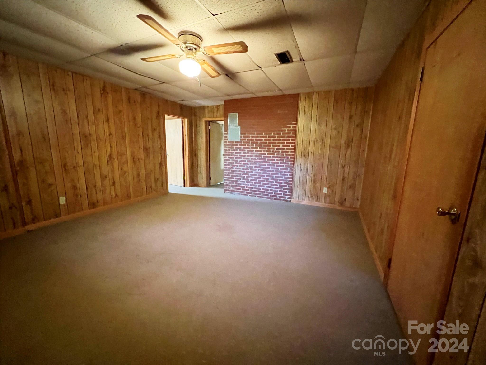 102 Steakhouse Road Morganton, NC 28655 - Photo 36 of 39 a view of a livingroom with a ceiling fan and window