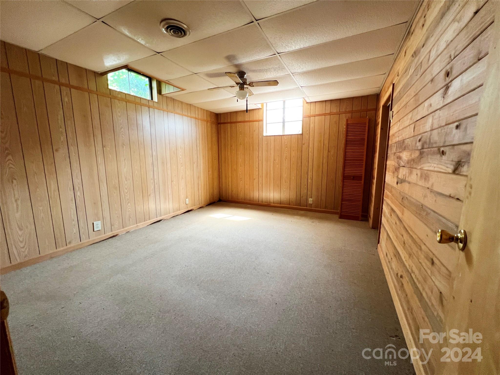 102 Steakhouse Road Morganton, NC 28655 - Photo 37 of 39 en empty room with a ceiling fan and window