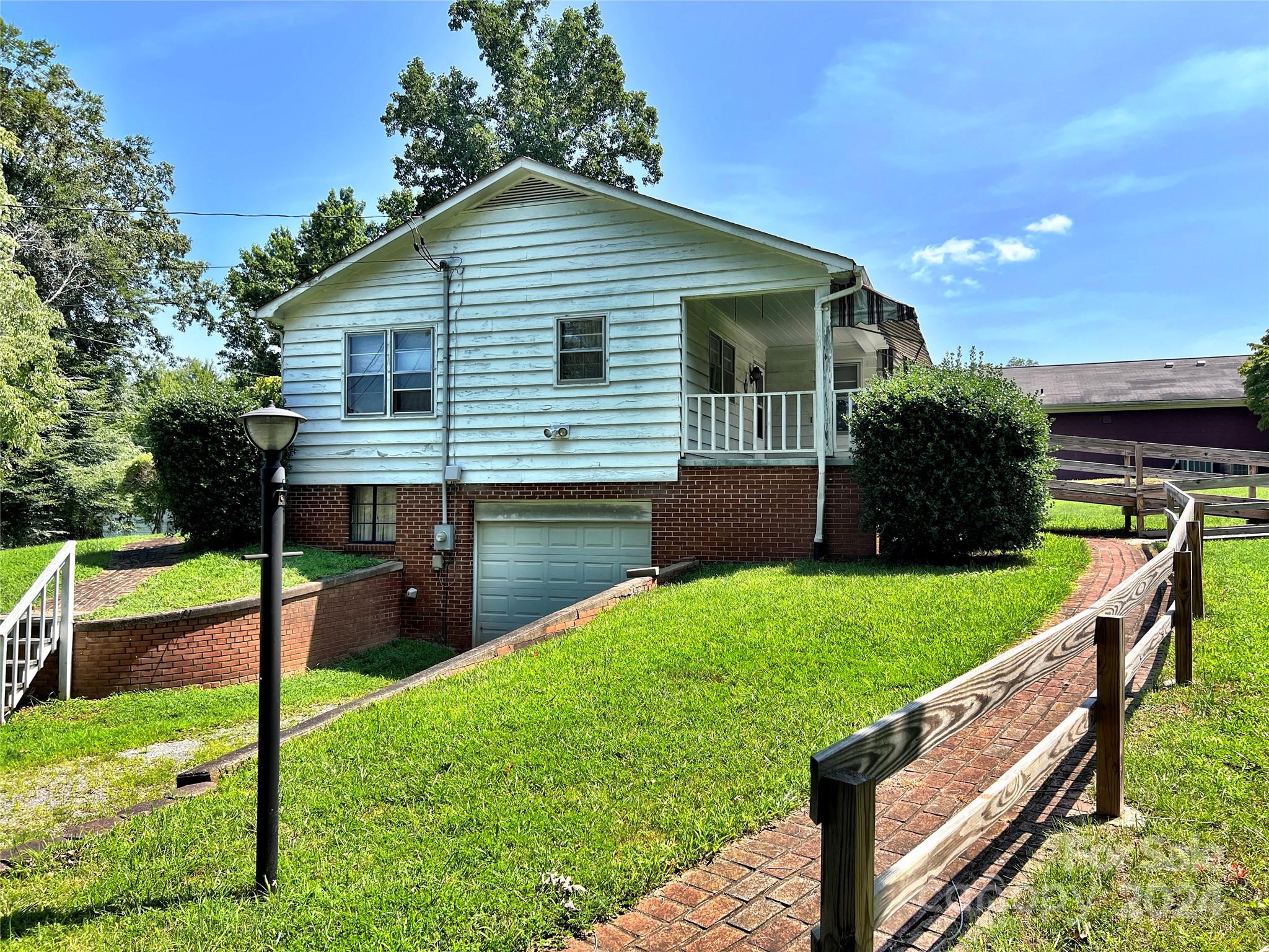 102 Steakhouse Road Morganton, NC 28655 - Photo 7 of 39 a front view of house with yard and green space