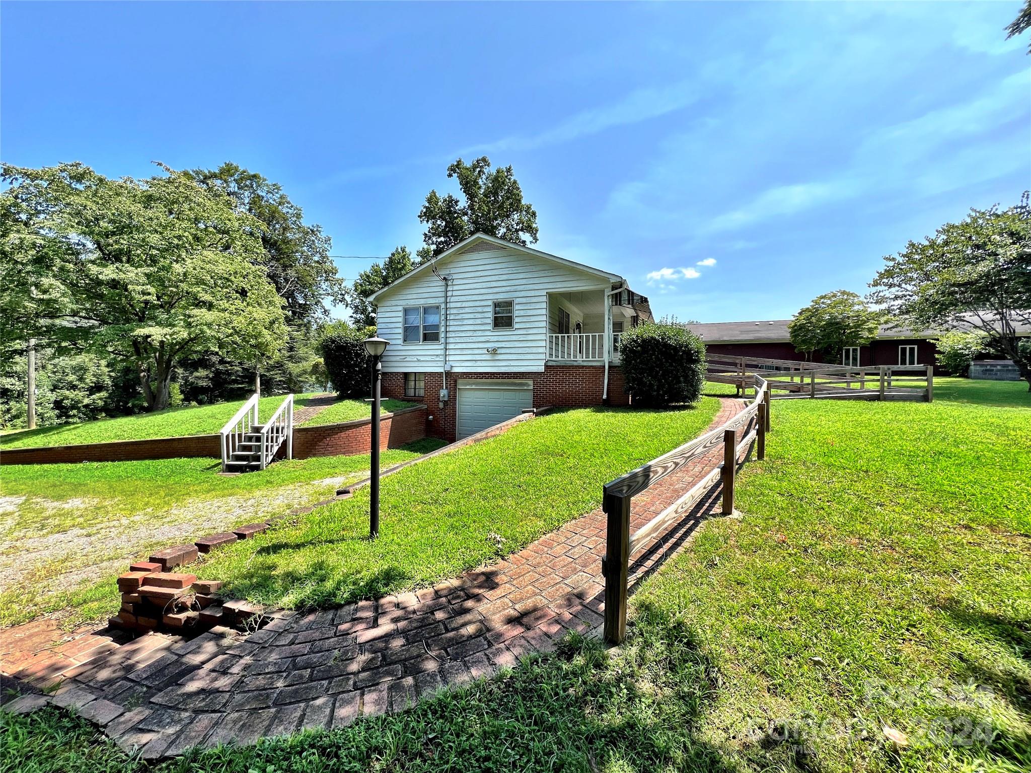 102 Steakhouse Road Morganton, NC 28655 - Photo 8 of 39 a garden with wooden fence
