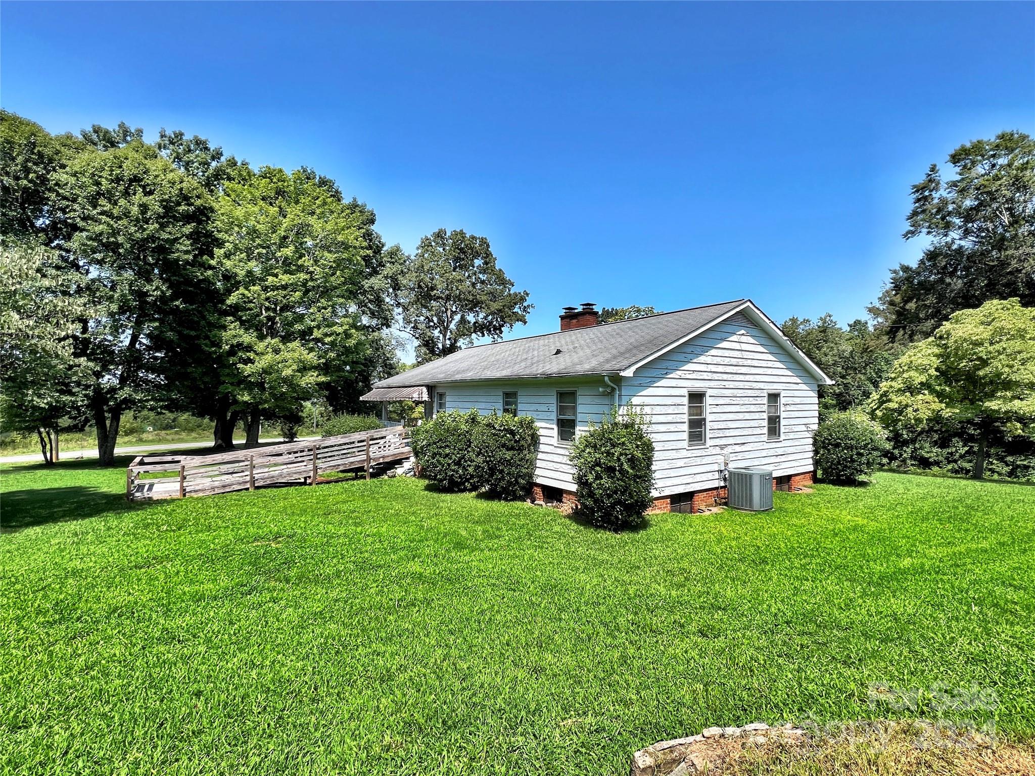 102 Steakhouse Road Morganton, NC 28655 - Photo 10 of 39 a view of a house with a yard and sitting area