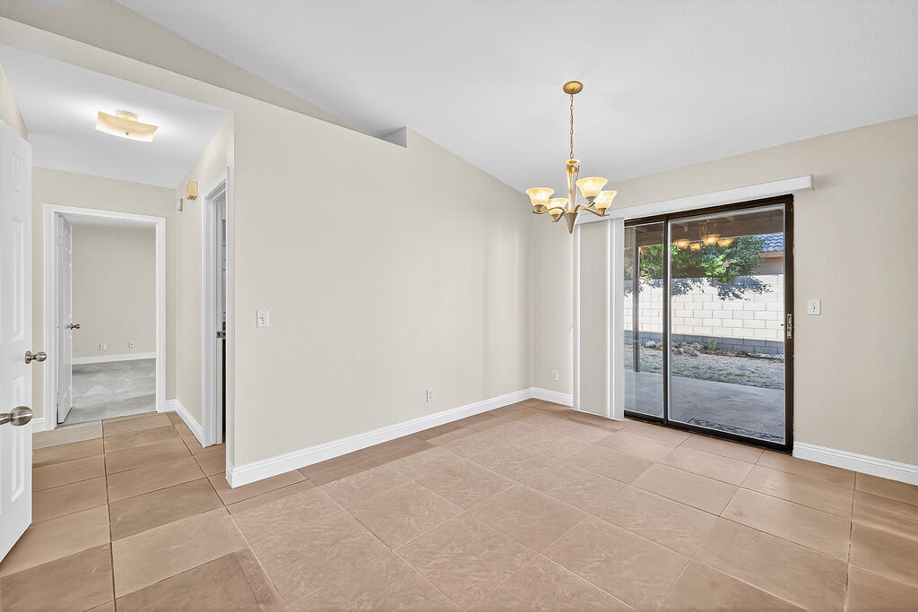 68615 Concepcion Road Cathedral City, CA 92234 - Photo 8 of 25 a view of a room with window chandelier and glass door