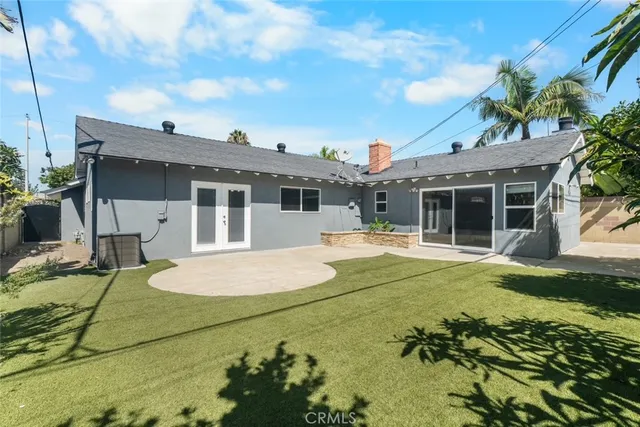 a view of house with swimming pool outdoor seating