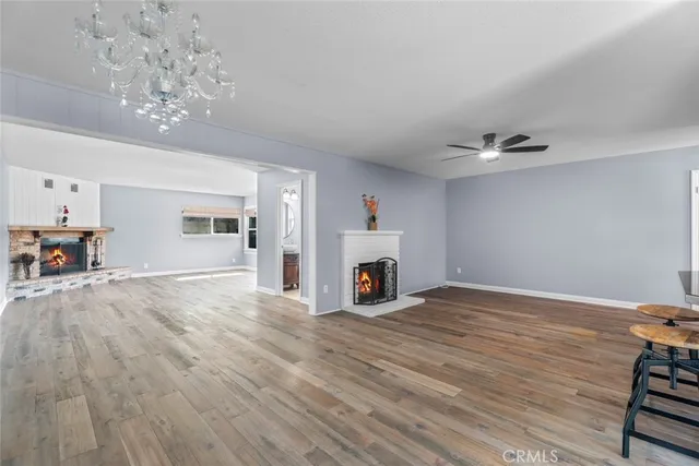 a view of livingroom with hardwood floor and a ceiling fan