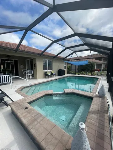 a view of a swimming pool with a patio