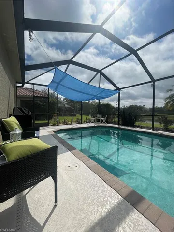 a view of swimming pool with a patio