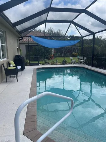 a view of a swimming pool with a patio