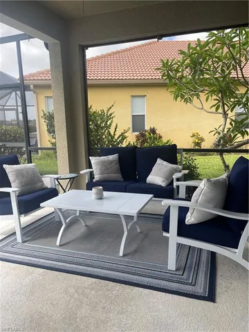 a view of livingroom with furniture and floor to ceiling window