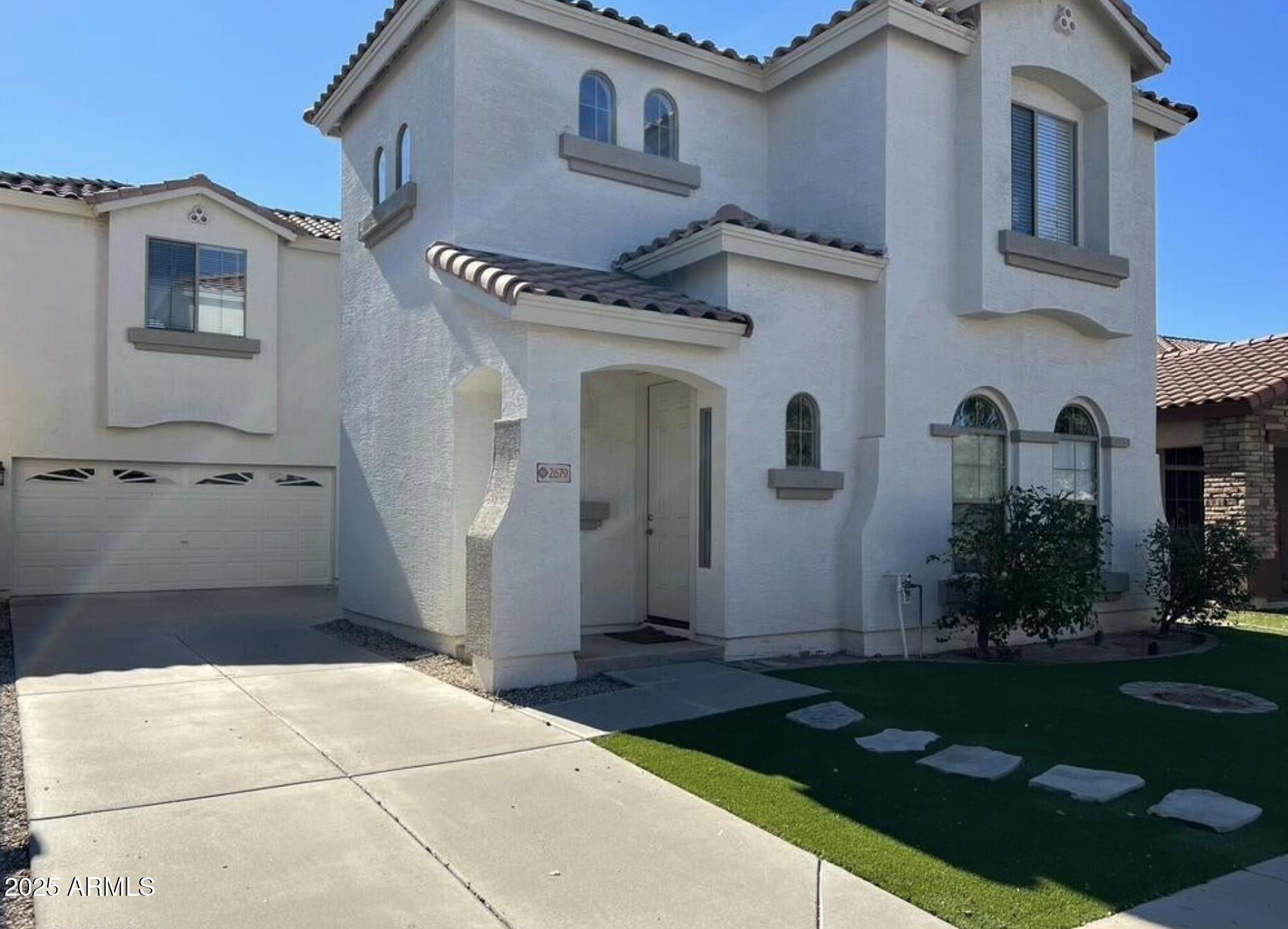 2679 East Chester Drive Chandler, AZ 85286 - Photo 1 of 30 a front view of a house with garden