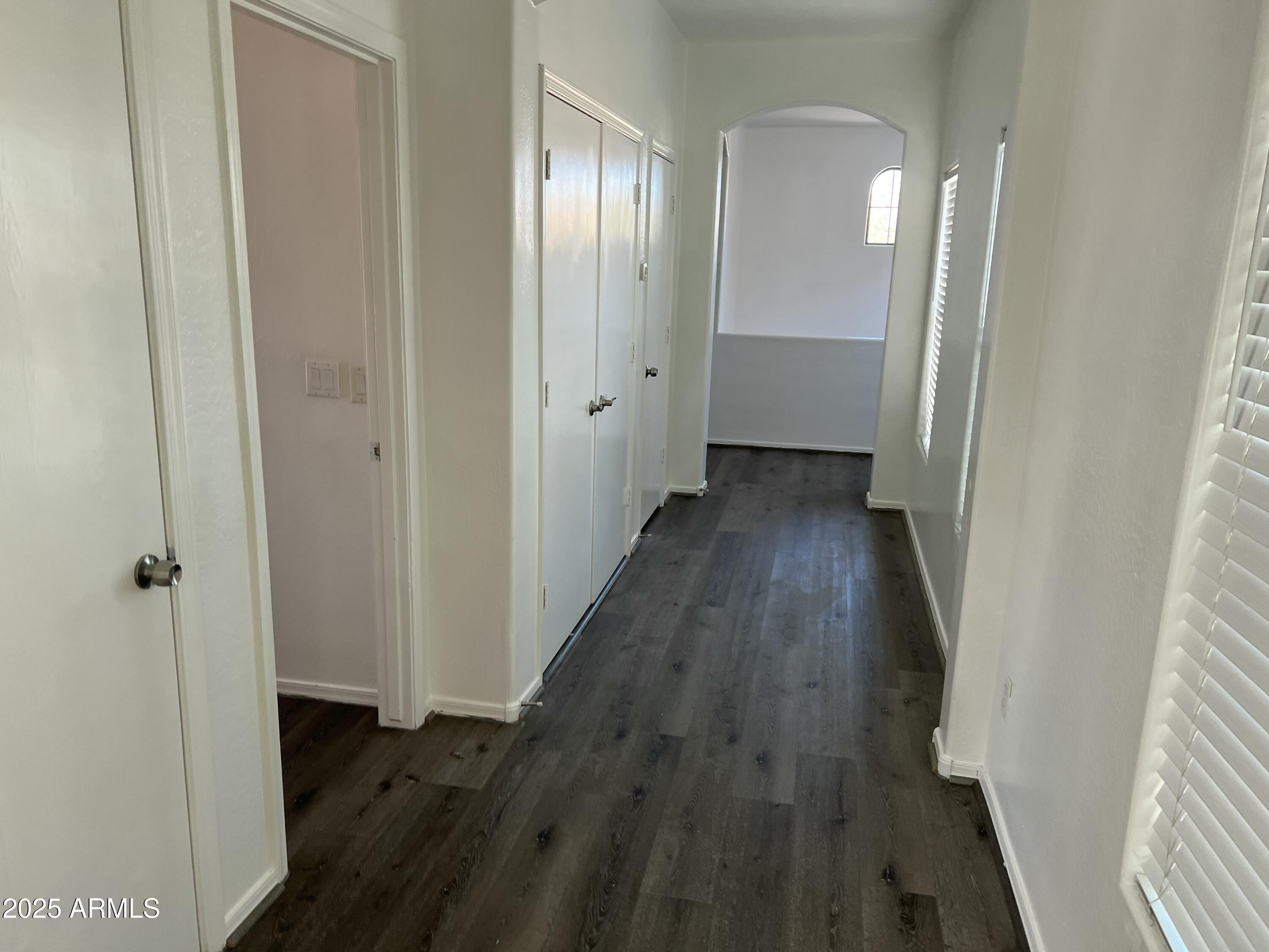 2679 East Chester Drive Chandler, AZ 85286 - Photo 19 of 30 a view of a hallway with wooden floor and a bathroom