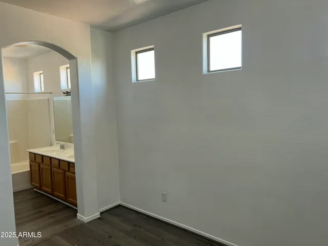 a room with a chair and wooden floor