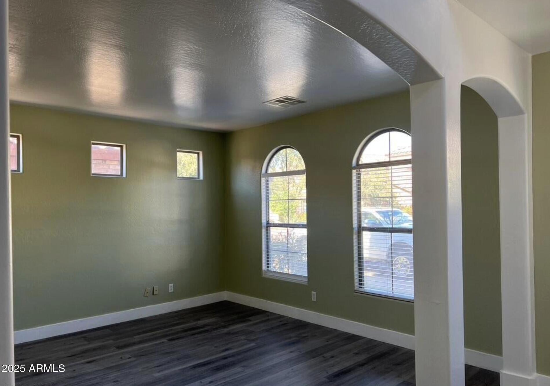 2679 East Chester Drive Chandler, AZ 85286 - Photo 29 of 30 a view of empty room with wooden floor and fan