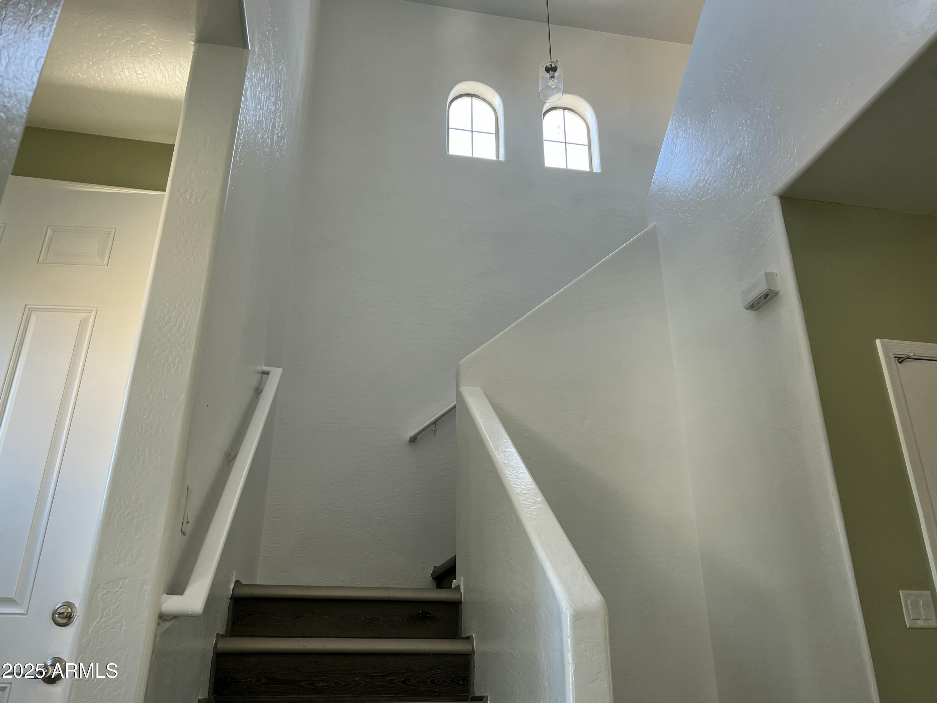 2679 East Chester Drive Chandler, AZ 85286 - Photo 5 of 30 a view of staircase with railing and white walls