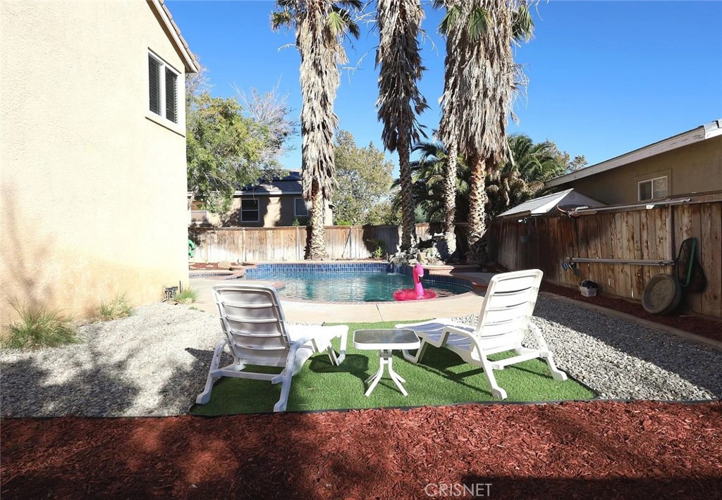 40046 Becky Lane Palmdale, CA 93551 - Photo 18 of 23 a view of backyard with outdoor seating and trees
